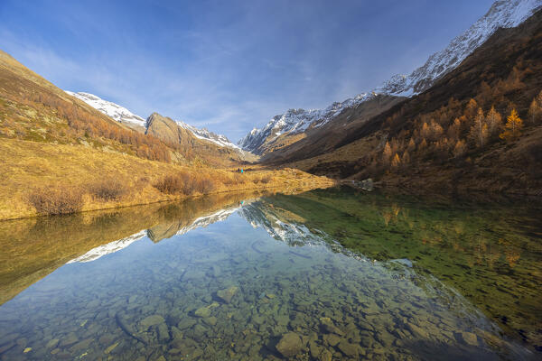 View of the Grundsee in Lotschental valley in autumn. Bernese Alps, canton of Valais, Switzerland.