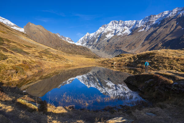 View of the Guggisee in Lotschental valley in autumn. Bernese Alps, canton of Valais, Switzerland.
