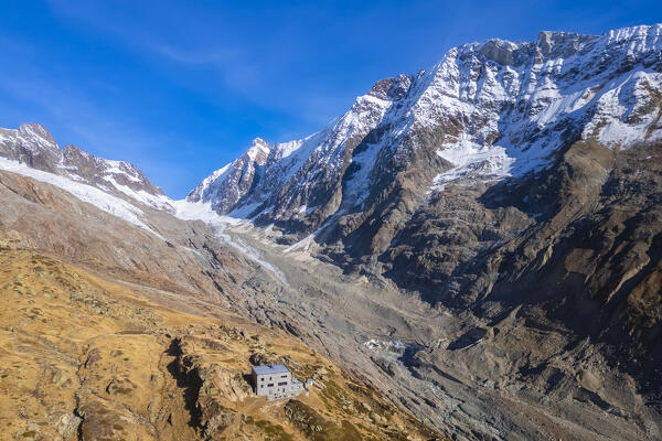 Aerial view of the Anenhutte refuge in Lotschental valley in autumn. Bernese Alps, canton of Valais, Switzerland.