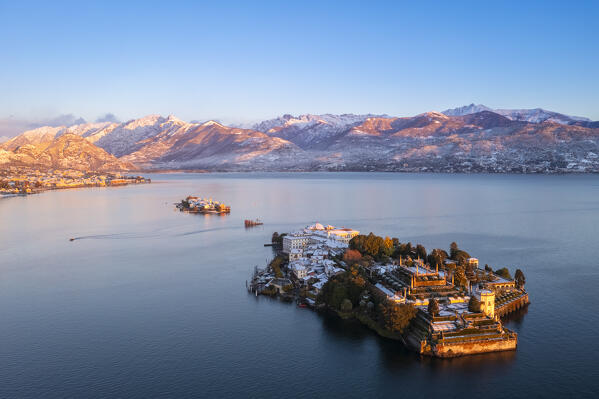 Aerial view of the Borromean Islands during a winter sunrise after a snowfall. Stresa, Lago Maggiore, Verbano Cusio Ossola district, Piedmont, Italy.