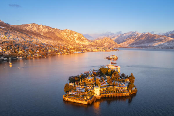 Aerial view of the Borromean Islands during a winter sunrise after a snowfall. Stresa, Lago Maggiore, Verbano Cusio Ossola district, Piedmont, Italy.