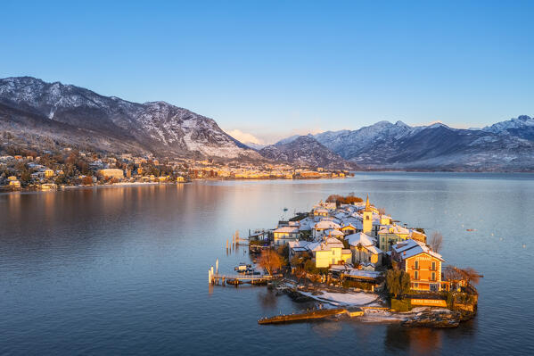 Aerial view of the Borromean Islands during a winter sunrise after a snowfall. Stresa, Lago Maggiore, Verbano Cusio Ossola district, Piedmont, Italy.