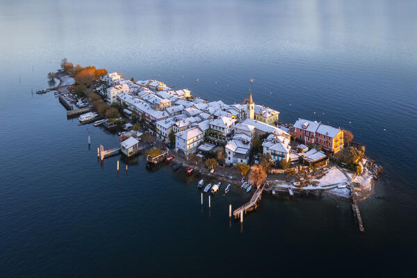 Aerial view of the Borromean Islands during a winter sunrise after a snowfall. Stresa, Lago Maggiore, Verbano Cusio Ossola district, Piedmont, Italy.