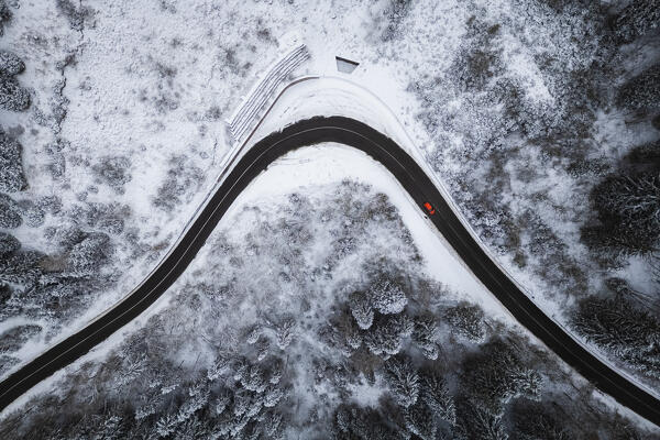 Aerial view of the road to Monte Pora in winter after a snowfall. Val Seriana, Bergamo district, Lombardy, Italy.