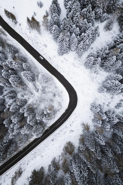 Aerial view of the road to Monte Pora in winter after a snowfall. Val Seriana, Bergamo district, Lombardy, Italy.