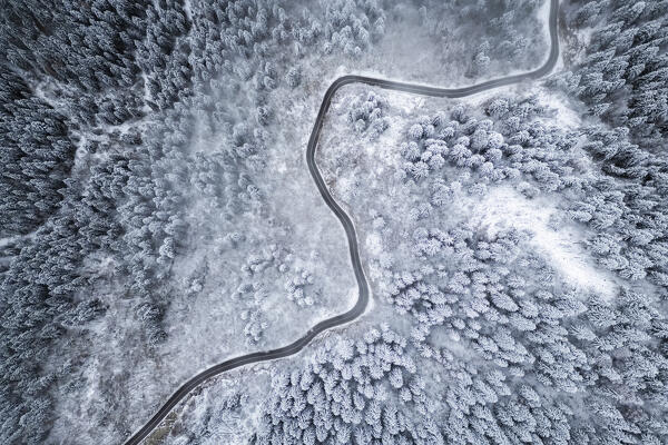 Aerial view of the road to Monte Pora in winter after a snowfall. Val Seriana, Bergamo district, Lombardy, Italy.