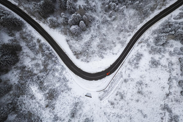Aerial view of the road to Monte Pora in winter after a snowfall. Val Seriana, Bergamo district, Lombardy, Italy.