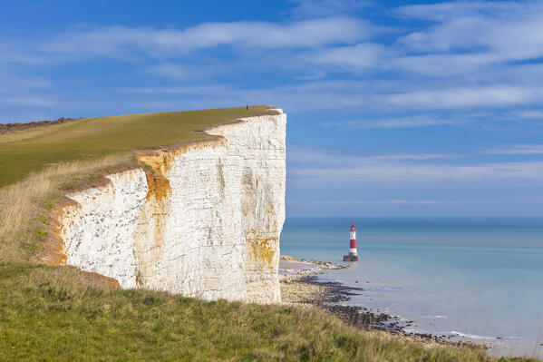 View of Beachy Head, a chalk headland in East Sussex, immediately east of the Seven Sisters and it's lighthouse. Eastbourne, East Sussex, Southern England.