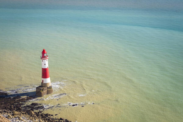 View of Beachy Head, a chalk headland in East Sussex, immediately east of the Seven Sisters and it's lighthouse. Eastbourne, East Sussex, Southern England.