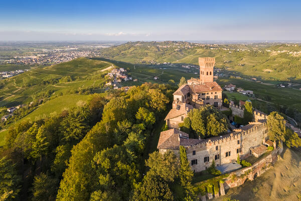 Aerial view of a summer sunset over the Cigognola castle. Cigognola, Oltrepo Pavese, Pavia district, Lombardy, Italy.