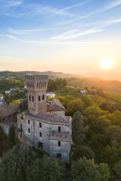Aerial view of a summer sunset over the Cigognola castle. Cigognola, Oltrepo Pavese, Pavia district, Lombardy, Italy.