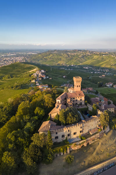 Aerial view of a summer sunset over the Cigognola castle. Cigognola, Oltrepo Pavese, Pavia district, Lombardy, Italy.