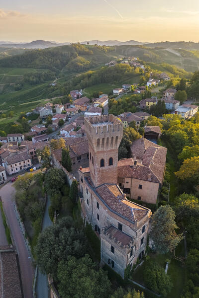 Aerial view of a summer sunset over the Cigognola castle. Cigognola, Oltrepo Pavese, Pavia district, Lombardy, Italy.