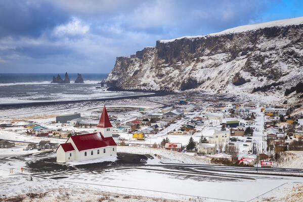 View of Víkurkirkja, Vik's church with red rooftop. Vik i Myrdal, Sudurland, Iceland, Northern Europe.