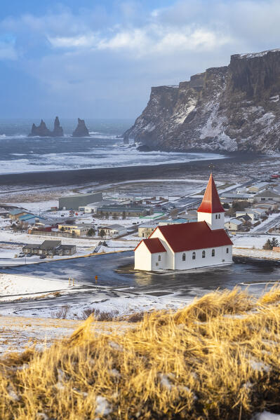 View of Víkurkirkja, Vik's church with red rooftop. Vik i Myrdal, Sudurland, Iceland, Northern Europe.