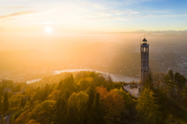 Aerial view of the Faro Voltiano (Volta Lighthouse) of Brunate overlooking Como and Como Lake in autumn. Brunate, Province of Como, Lombardy, Italy, Europe.