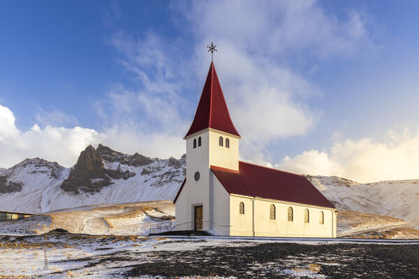 View of Víkurkirkja, Vik's church with red rooftop. Vik i Myrdal, Sudurland, Iceland, Northern Europe.