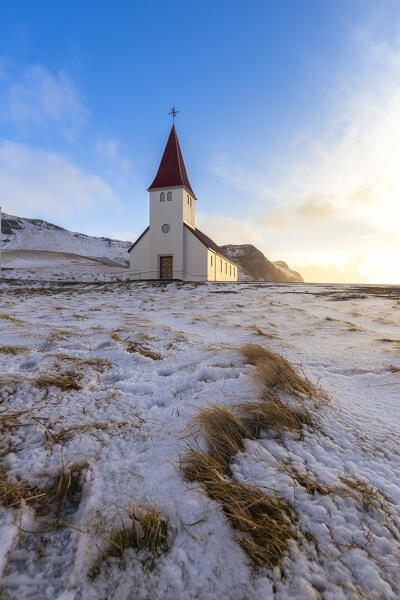 View of Víkurkirkja, Vik's church with red rooftop. Vik i Myrdal, Sudurland, Iceland, Northern Europe.