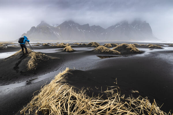 View of the black sand dunes in front of Vestrahorn mountain. Stokksnes peninsula, Hofn, Austurland, Iceland, Europe.