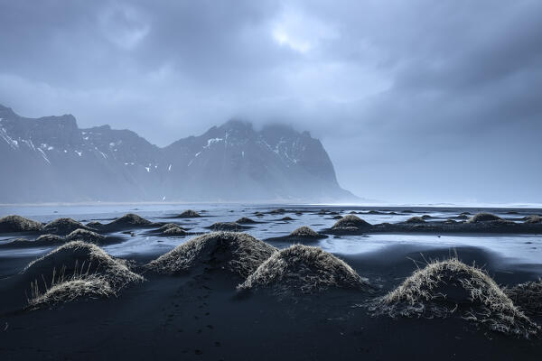 View of the black sand dunes in front of Vestrahorn mountain. Stokksnes peninsula, Hofn, Austurland, Iceland, Europe.