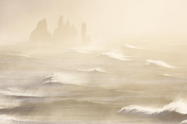 View of the sea stacks near Reynisfjara beach during sunrise in winter from Dyrholaey. Vík í Mýrdal, southern Iceland, Iceland, Northern Europe.