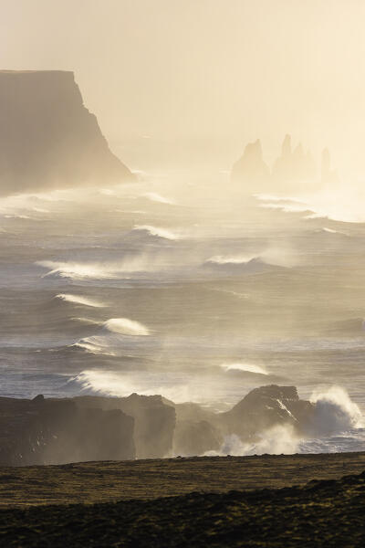 View of the sea stacks near Reynisfjara beach during sunrise in winter from Dyrholaey. Vík í Mýrdal, southern Iceland, Iceland, Northern Europe.