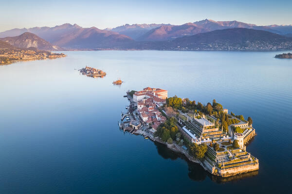 Aerial view of the Borromean Islands during a winter sunrise. Stresa, Lago Maggiore, Verbano Cusio Ossola district, Piedmont, Italy.