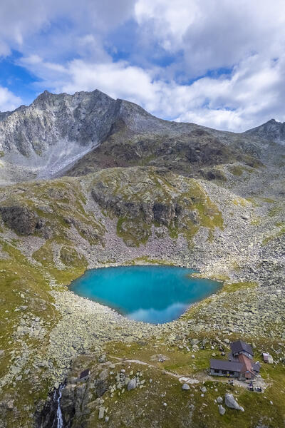View of the Franco Tonolini refuge and Lake Rotondo in the beautiful Val Miller. Sonico, Val Camonica, Brescia district, Lombardy, Italy.