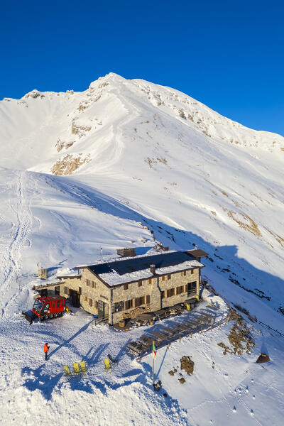Aerial view of the Rifugio Capanna 2000 at the foothills of Pizzo Arera in winter covered in snow. Val Serina, Zambla Alta, Bergamo district, Lombardy, Italy, Southern Europe.