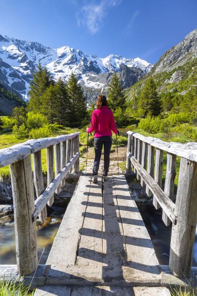 Summer view of a girl walking near the Aviolo lake in the Adamello park. Edolo,Brescia province, Italy, Europe. (MR)