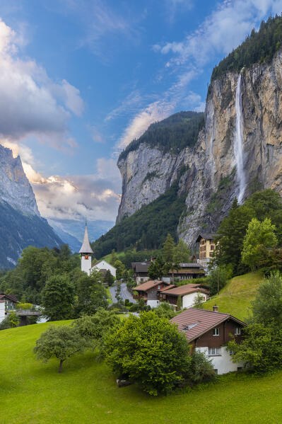 View of the small village of Lauterbrunnen at sunset in summer. Lauterbrunnen, Canton of Bern, Switzerland, Europe.
