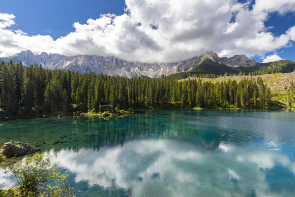 View of the Karersee lake in summer. Carezza, Dolomites, South Tyrol, Trentino Alto Adige, Italy. 