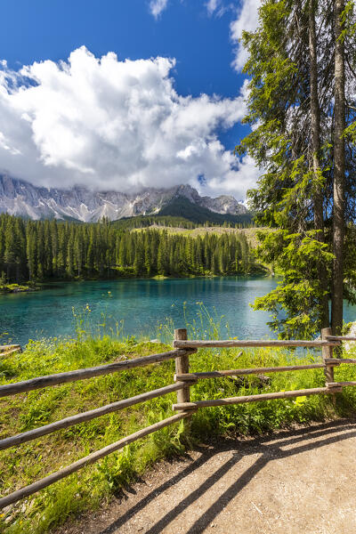 View of the Karersee lake in summer. Carezza, Dolomites, South Tyrol, Trentino Alto Adige, Italy. 
