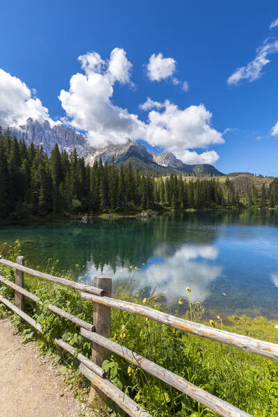 View of the Karersee lake in summer. Carezza, Dolomites, South Tyrol, Trentino Alto Adige, Italy. 