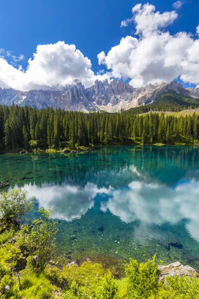 View of the Karersee lake in summer. Carezza, Dolomites, South Tyrol, Trentino Alto Adige, Italy. 