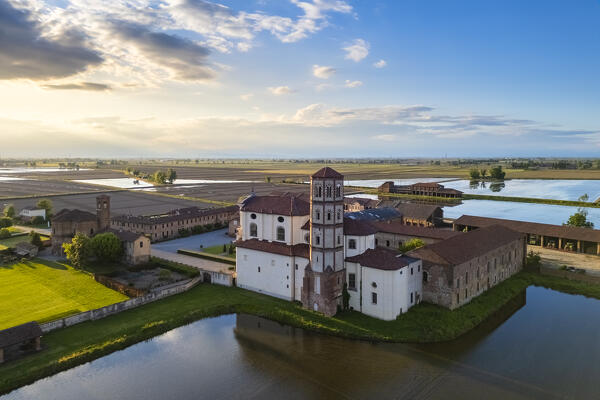 Aerial view of the flooded rice fields near the Principality of Lucedio at sunset. Trino Vercellese, Vercelli district, Piedmont, Italy.
