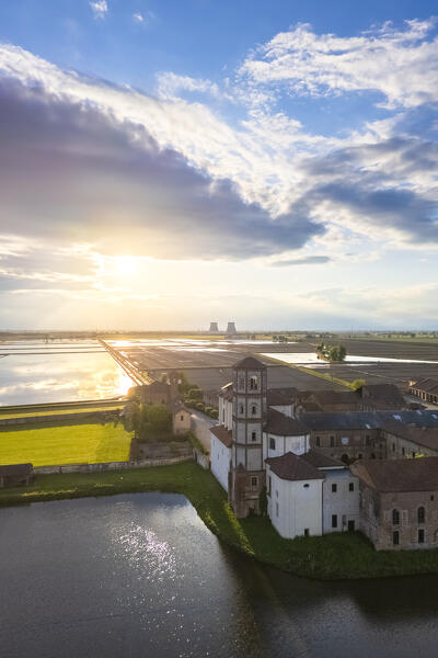 Aerial view of the flooded rice fields near the Principality of Lucedio at sunset. Trino Vercellese, Vercelli district, Piedmont, Italy.
