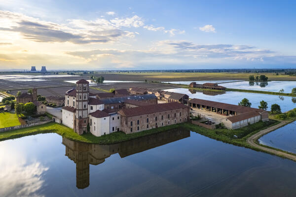 Aerial view of the flooded rice fields near the Principality of Lucedio at sunset. Trino Vercellese, Vercelli district, Piedmont, Italy.