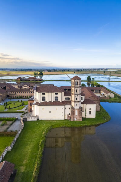 Aerial view of the flooded rice fields near the Principality of Lucedio at sunset. Trino Vercellese, Vercelli district, Piedmont, Italy.