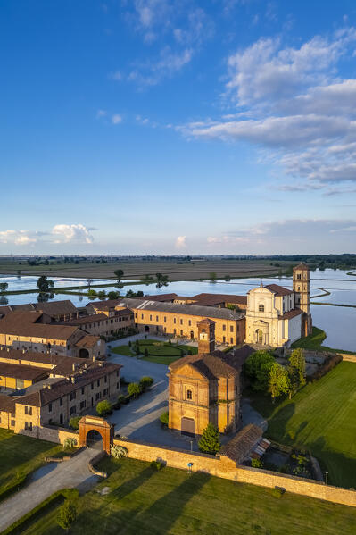 Aerial view of the flooded rice fields near the Principality of Lucedio at sunset. Trino Vercellese, Vercelli district, Piedmont, Italy.