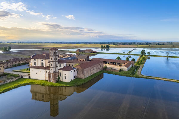 Aerial view of the flooded rice fields near the Principality of Lucedio at sunset. Trino Vercellese, Vercelli district, Piedmont, Italy.