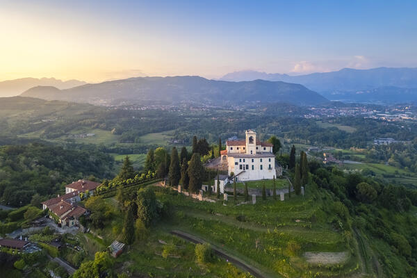 View of Santuario della Beata Vergine del Carmelo at the top of a hill at sunset in spring. Montevecchia, Lecco district, Lombardy, Italy.