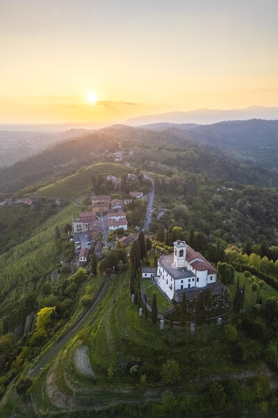 View of Santuario della Beata Vergine del Carmelo at the top of a hill at sunset in spring. Montevecchia, Lecco district, Lombardy, Italy.