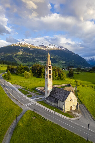 Spring sunset over the church of Premadio. Bormio, Valtellina, Lombardy, Italy, Europe.