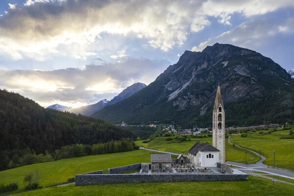 Spring sunset over the church of Premadio. Bormio, Valtellina, Lombardy, Italy, Europe.