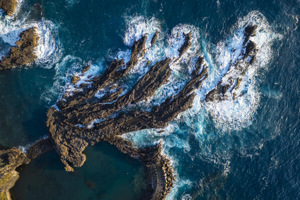 Aerial view of the natural pools on the coast of Seixal during sunrise. Madeira, Portugal, Europe.