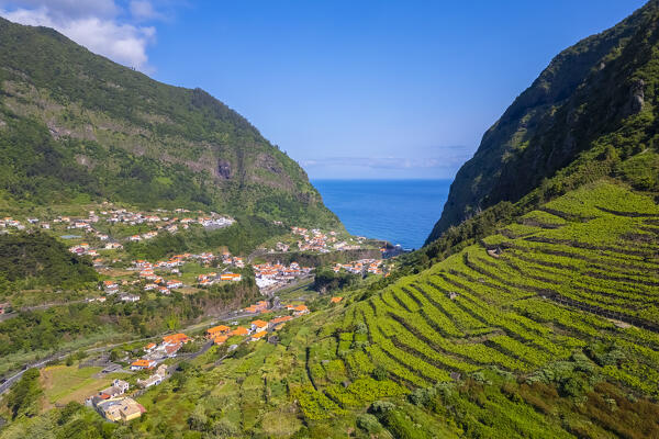 Aerial view of terraces near Capelinha de Nossa Senhora de Fatima just after sunrise in spring. Sao Vicente, Madeira, Portugal, Europe.