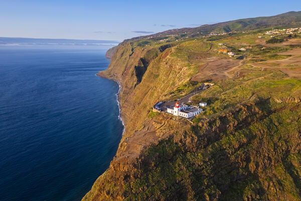 Aerial view of the amazing lighthouse called Farol da Ponta do Pargo at sunset in spring. Madeira, Portugal, Europe.