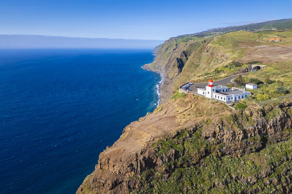 Aerial view of the amazing lighthouse called Farol da Ponta do Pargo at sunset in spring. Madeira, Portugal, Europe.
