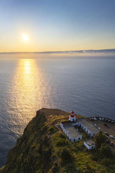 Aerial view of the amazing lighthouse called Farol da Ponta do Pargo at sunset in spring. Madeira, Portugal, Europe.